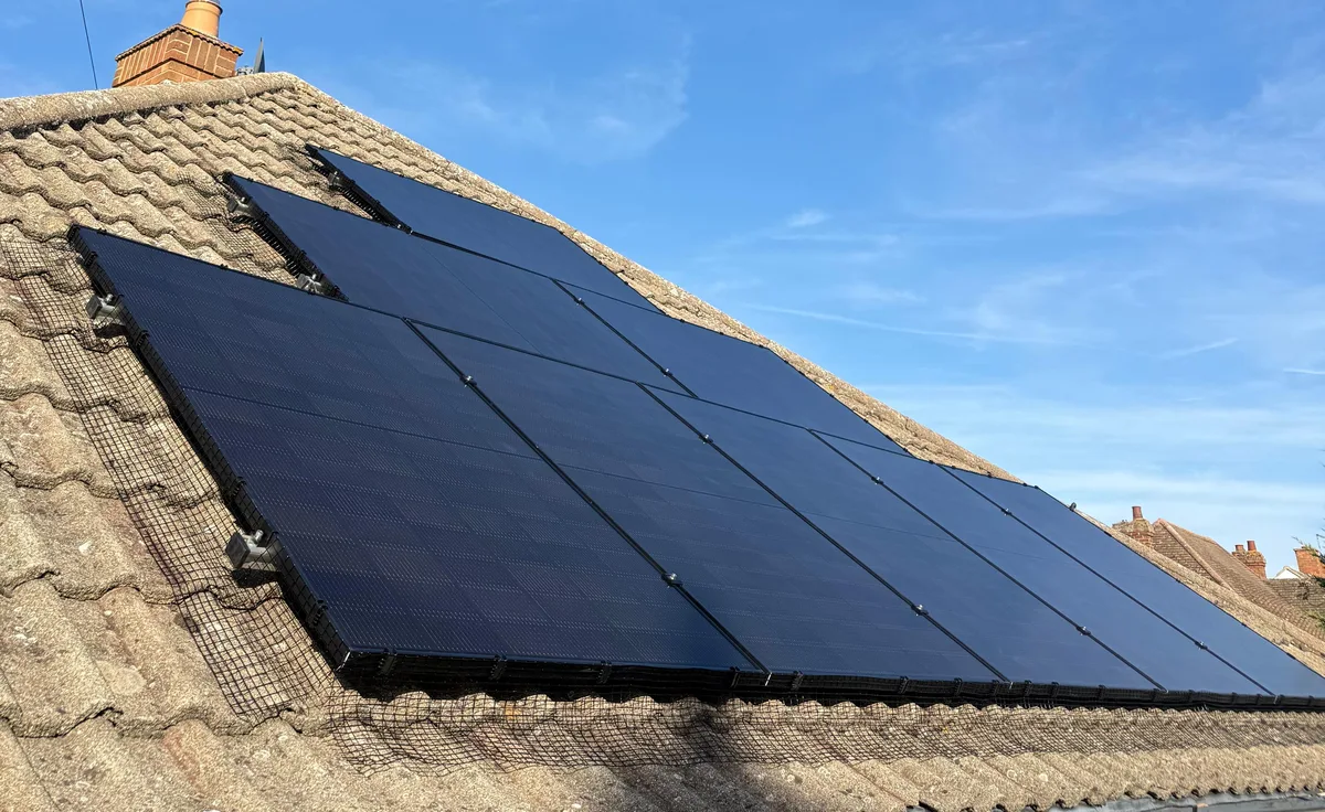All-black DMEGC solar panels with bird-proofing mesh, fitted by ECONEXIS in Bedford